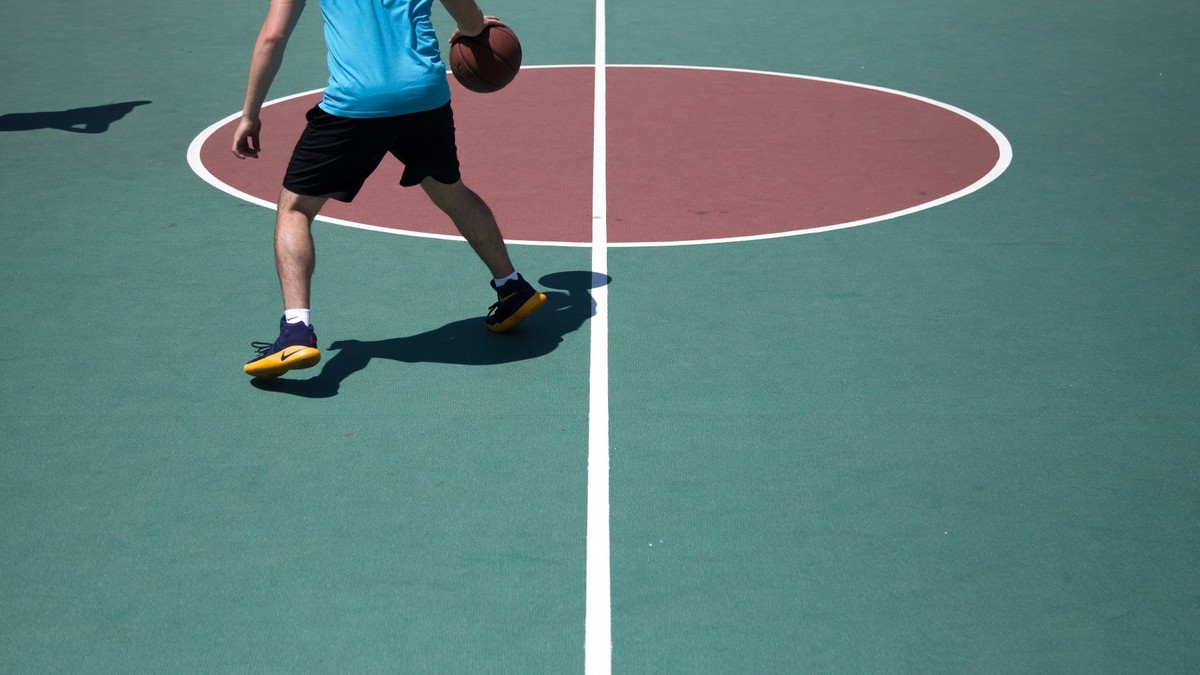 Playing basketball at a sports camp.